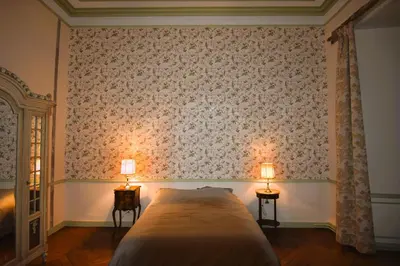 Un ou plusieurs lits dans un hébergement de l'établissement La Chambre Verte - Château de la Chauvelière