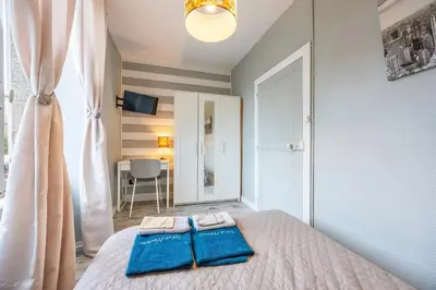 Un ou plusieurs lits dans un hébergement de l'établissement Chambre Rêve américain