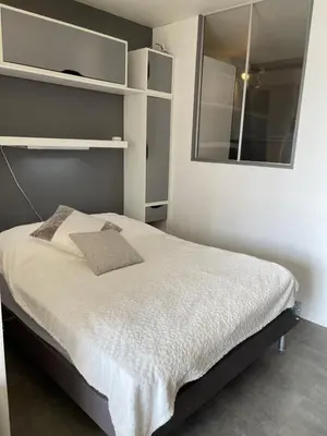 Un ou plusieurs lits dans un hébergement de l'établissement Appartement Studio 35 m2 face à l'Ocean