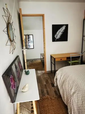 Un ou plusieurs lits dans un hébergement de l'établissement Studio - Chez Ana et Jonathan