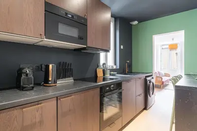 Cuisine ou kitchenette dans l'établissement Appartement élégant proche Tramway & Centre-Ville