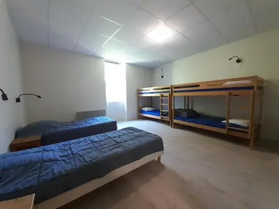 Un ou plusieurs lits dans un hébergement de l'établissement Village de Gîtes du Moulin Neuf