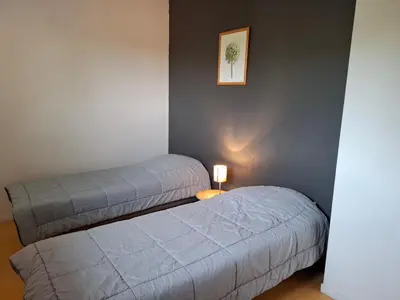 Un ou plusieurs lits dans un hébergement de l'établissement Village de Gîtes du Moulin Neuf
