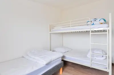 Un ou plusieurs lits dans un hébergement de l'établissement Maison pour 6 adultes et 3 enfants - Terrasse