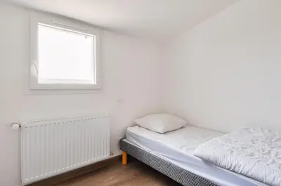 Un ou plusieurs lits dans un hébergement de l'établissement Maison pour 6 adultes et 3 enfants - Terrasse