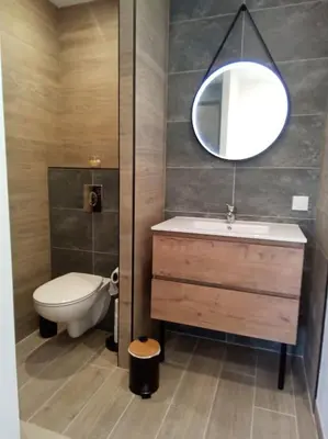 Salle de bains dans l'établissement Les Noisetiers