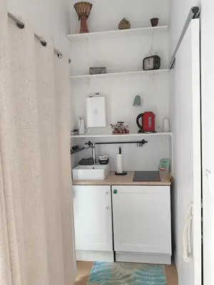 Cuisine ou kitchenette dans l'établissement Bienvenue