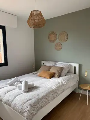 Un ou plusieurs lits dans un hébergement de l'établissement L'Échappée Belle - Appartement charmant et chaleureux