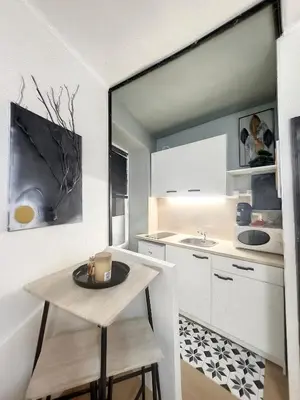 Cuisine ou kitchenette dans l'établissement Le petit duplex du Paul B