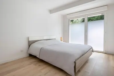 Un ou plusieurs lits dans un hébergement de l'établissement Maison pour 8, avec jacuzzi à 200m de la plage