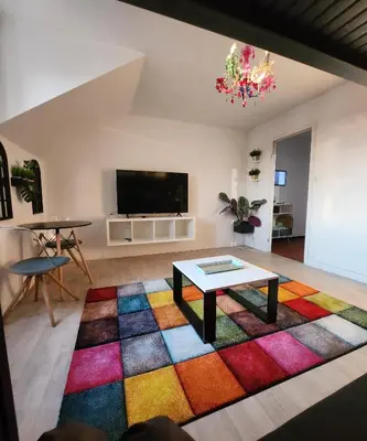 Télévision ou salle de divertissement dans l'établissement WELCOME