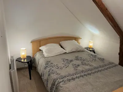 Un ou plusieurs lits dans un hébergement de l'établissement Gîte de la Haie des Bois - 8P