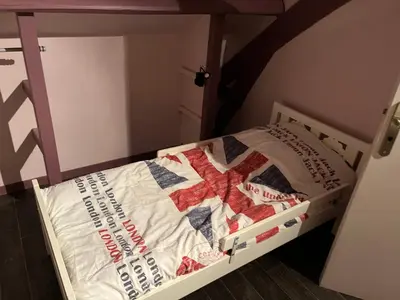 Un ou plusieurs lits dans un hébergement de l'établissement Gîte de la Haie des Bois - 8P