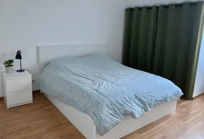 Un ou plusieurs lits dans un hébergement de l'établissement Charment Appartement Duplex - Pornichet