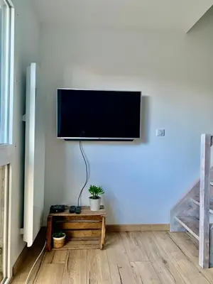Télévision ou salle de divertissement dans l'établissement Charment Appartement Duplex - Pornichet