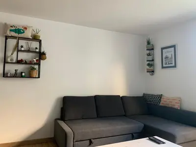 Coin salon dans l'établissement Charment Appartement Duplex - Pornichet