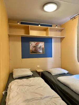 Un ou plusieurs lits dans un hébergement de l'établissement Mobile home 6 personnes Climatisé proche Puy du fou Clisson 800FA