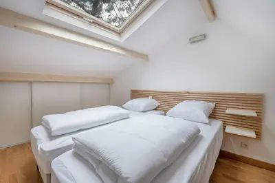 Un ou plusieurs lits dans un hébergement de l'établissement Maison rénovée pour 8 - 200m Tharon plage