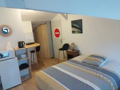 Un ou plusieurs lits dans un hébergement de l'établissement Studio au coeur de la ferme