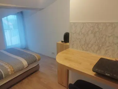 Un ou plusieurs lits dans un hébergement de l'établissement Studio au coeur de la ferme