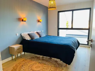 Un ou plusieurs lits dans un hébergement de l'établissement Maison neuve 3 chambres Nantes - confort pour famille & amis, wifi, parking