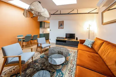 Coin salon dans l'établissement L'élégance - Wifi - Climatisé - Vintage