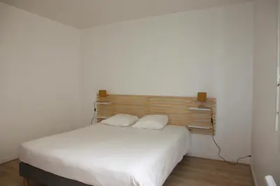 Un ou plusieurs lits dans un hébergement de l'établissement Résid'Spa Loire & Sèvre - Appartement