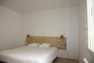 Un ou plusieurs lits dans un hébergement de l'établissement Résid'Spa Loire & Sèvre - Appartement