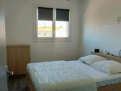 Un ou plusieurs lits dans un hébergement de l'établissement Spacieux appartement 4 pers à 200m de la plage avec parking privé - FR-1-323-443