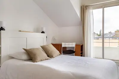 Un ou plusieurs lits dans un hébergement de l'établissement Epicea- Spacieux 3 chambres avec parking.