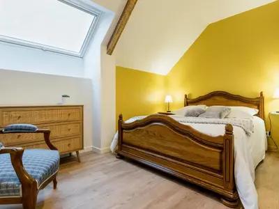 Un ou plusieurs lits dans un hébergement de l'établissement Gîte familial rénové près du Canal de Nantes avec jardin, terrasse, wifi et chambres mansardées - FR-1-306-1263