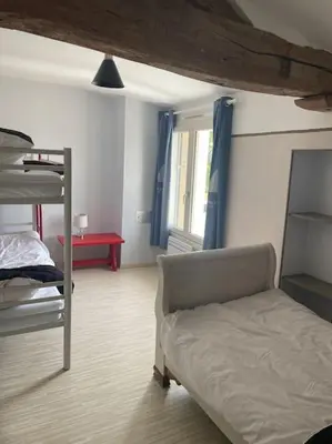 Un ou plusieurs lits dans un hébergement de l'établissement Gite spacieux 290m2, SPA Ext, Billard et babyfoot.