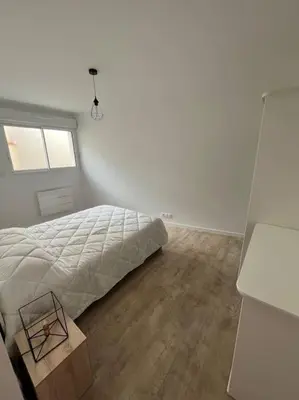Un ou plusieurs lits dans un hébergement de l'établissement Appartement neuf avec patio