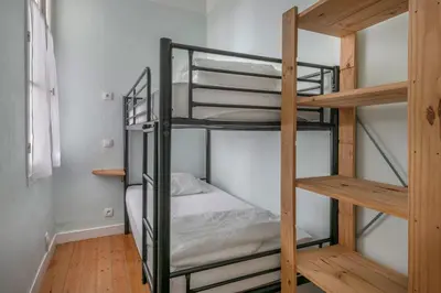 Un ou plusieurs lits dans un hébergement de l'établissement Appartement Vue mer pour 4 à 50m Plage