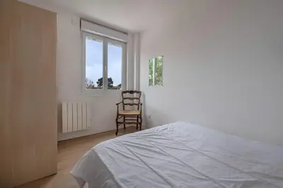 Un ou plusieurs lits dans un hébergement de l'établissement Appartement Vue mer pour 4 à 50m Plage