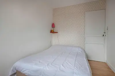 Un ou plusieurs lits dans un hébergement de l'établissement Appartement Vue mer pour 4 à 50m Plage