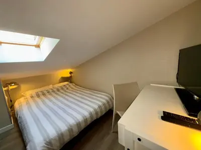 Un ou plusieurs lits dans un hébergement de l'établissement Superbe maison 4 chambres, proche plage, au calme, avec WIFI - FR-1-323-375