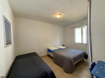 Un ou plusieurs lits dans un hébergement de l'établissement Spacieuse maison à St Jean de Monts, animaux admis, parking - FR-1-323-495