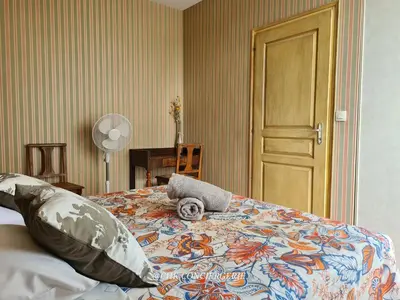 Un ou plusieurs lits dans un hébergement de l'établissement Le Repère Charmant Appartement Familial au Cœur des Herbiers à 12 min du Puy duFou