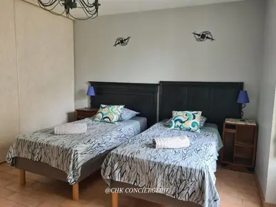 Un ou plusieurs lits dans un hébergement de l'établissement Le Repère Charmant Appartement Familial au Cœur des Herbiers à 12 min du Puy duFou