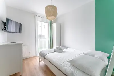 Un ou plusieurs lits dans un hébergement de l'établissement Le Rex - Bel appt avec sauna