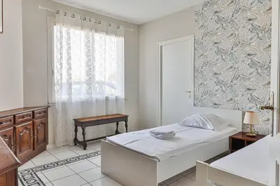 Un ou plusieurs lits dans un hébergement de l'établissement Violette Villa - Piscine