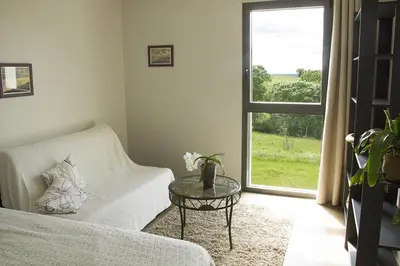 Un ou plusieurs lits dans un hébergement de l'établissement Chambre de la Divatte