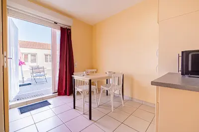 Télévision ou salle de divertissement dans l'établissement Appartement 27 Groix