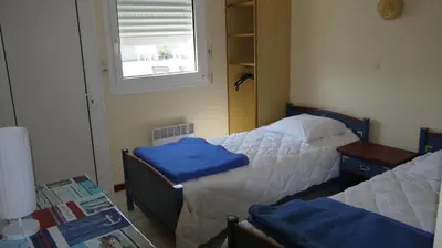 Un ou plusieurs lits dans un hébergement de l'établissement Appart 4/6 pers proche centre et acces direct plage : Ouessant