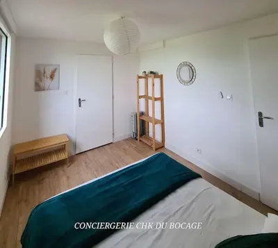 Un ou plusieurs lits dans un hébergement de l'établissement Le Petit Loup grande maison de charme en campagne