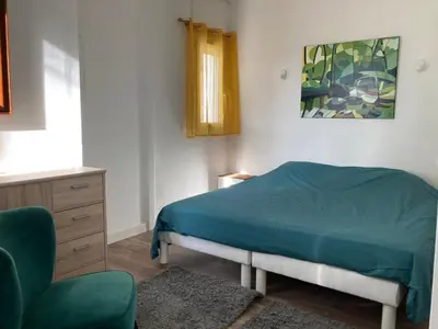 Un ou plusieurs lits dans un hébergement de l'établissement Maisonnette au calme prôche forêt et bord de mer