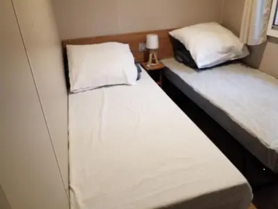 Un ou plusieurs lits dans un hébergement de l'établissement Mobil home Aventura 6-8 personnes tout confort