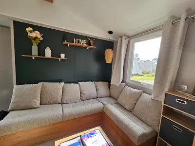 Coin salon dans l'établissement Jolie Mobil home 2 chambres (198)