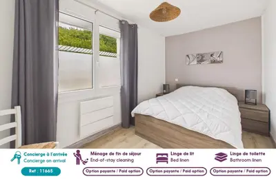 Un ou plusieurs lits dans un hébergement de l'établissement Appartement pour 4 avec grand jardin